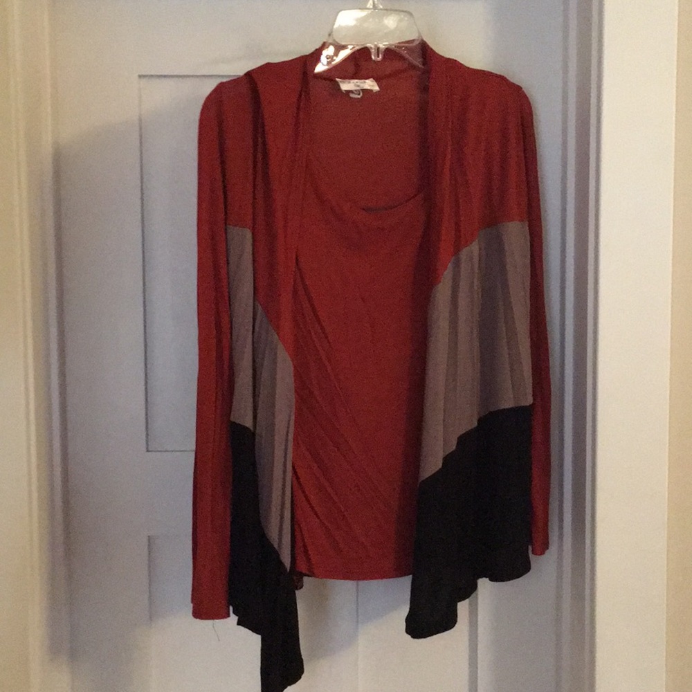 Soft tank top with attached long sleeves.